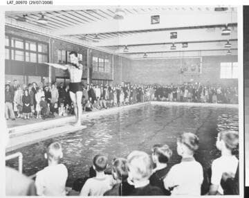 Diver performs during dedication of Harry Chandler Memorial Pool