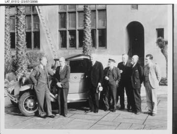Harry Chandler and others posed with automobile