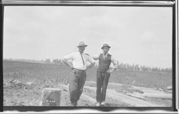 Two inspectors standing near the well at Chino Substation