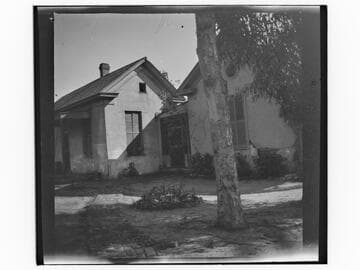Unidentified brick house with brick walkway