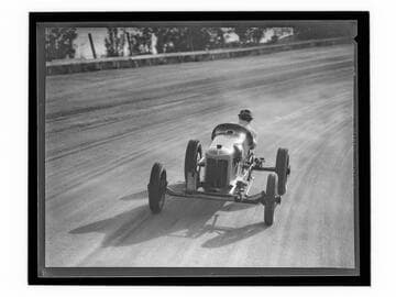 Race car driver Barney Oldfield on track at Legion Ascot Speedway, Los Angeles
