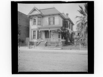 Unidentified house with iron gate and fence
