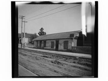 Adobe building with "to lease" sign - "Property running to New High St." (Los Angeles)