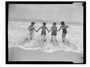 Children holding hands in the surf, Santa Monica