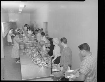 Students being served in a High School cafeteria line