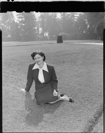 Woman sitting on lawn with 2 variants