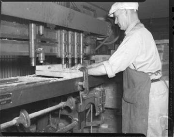 Machinist working with milling machine