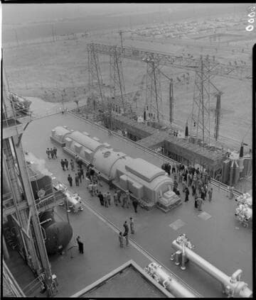 Overhead shot of people gathered on the turbine deck for the dedication of Etiwanda Steam Plant