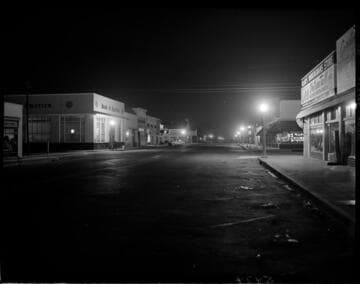 Street lighting on a business district street at night