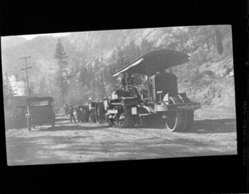 Early model Caterpillar tractors used to haul materials to Rush Creek plant site from Benton RR station 56 miles away