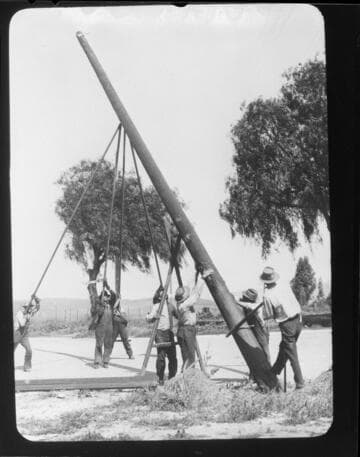 Raising a power pole using gin-