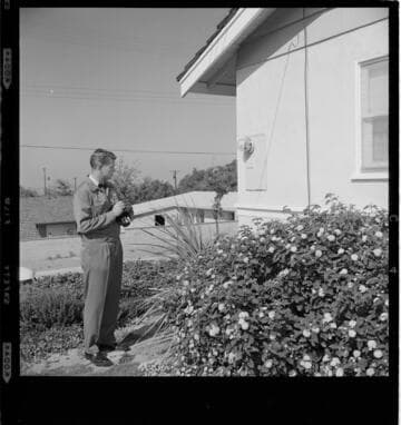 Meter reader visiting customer meters and recording data