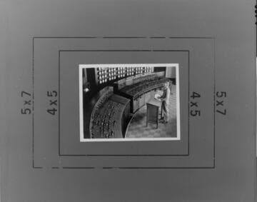 Operator Bill Howardson monitors plant machinery and system electric demand in the control room at Long Beach Steam Plant No