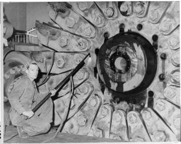 The large size of the Pelton wheels used at Big Creek can be seen from this picture taken during a repair project in 1948