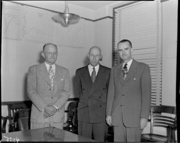 Three men in an office