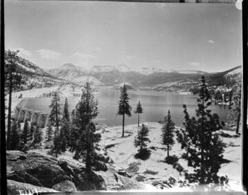 A copyneg of an old photo of Florence Lake Dam and reservoir