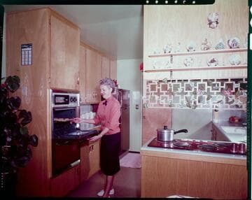 Woman baking cookies in her all-