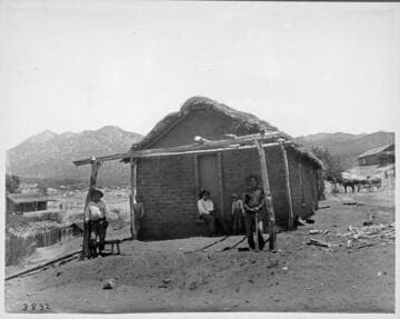 Agua Caliente adobe house.  Simon Cidinoat [?] and son Trincoline at their home