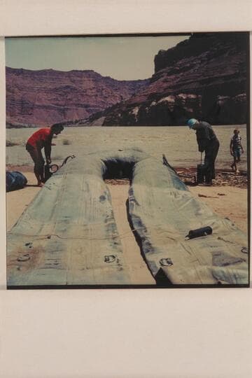 Georgie and J. R. White pump the boloney in preparation for departure from Paria Riffle on June 03