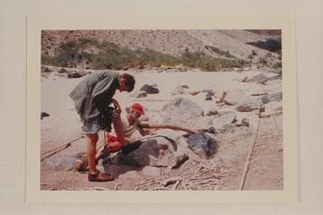 Bill Beer and Ballard Atherton work at camera detail; Whitmore Beach