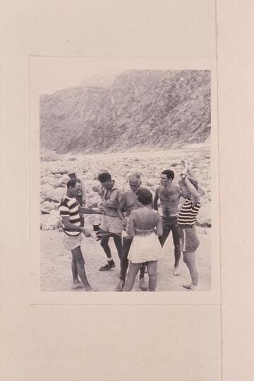 Puzzles at Diamond Creek camp of the 1948 Nevills party.  Wright in distance, Nevills, Doerr, Masland, Nancy Streator, Garth Marston and Rosalind Johnson