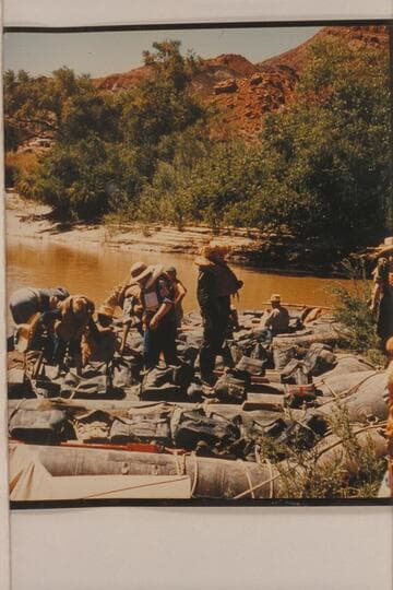 Georgie White's outfit and part of the crew at Lees Ferry in preparation for her 1956, July traverse of the Grand Canyon