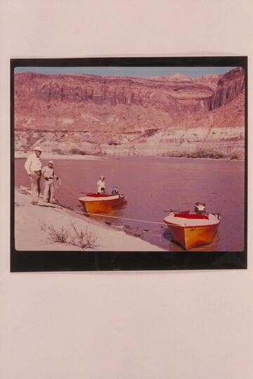 The Harris-Brennan motor-boats in Glen Canyon.  Brennan is at left and Harris is next to him; below Trachyte Rapid