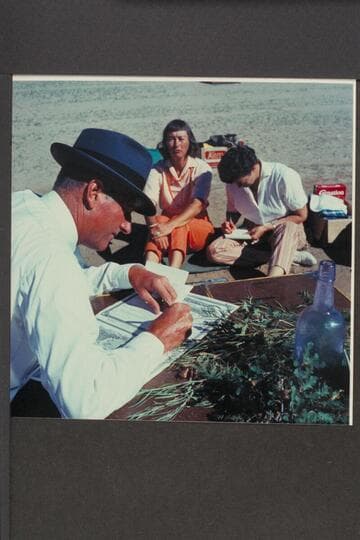 Bishop Wells makes out the wedding papers.  Dorothy Aleson and Nina Robison in the background prepare the news.  The Chapel; Mile 118 1/2; Glen Canyon