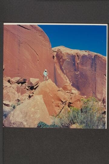 Aleson on rocks back of point of assembly of dredge