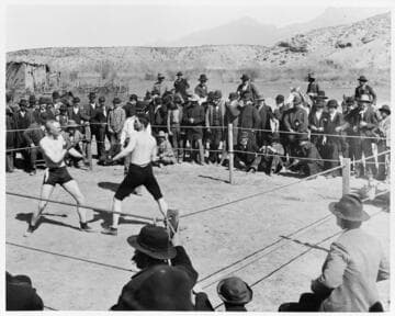 Prize fight in desert country ring, possibly in Juarez, Mexico