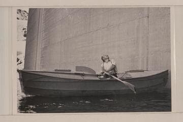 Buzz Holmstrom in his boat at the face of Hoover Dam