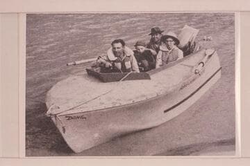 "DONZ", the wizard hull powered with outboard motor used by Don Harris on the Yampa and upper Green Rivers in 1954.   In the boat:  Don Harris, Barry White, Harry Ishimatsu and Mary Lou White