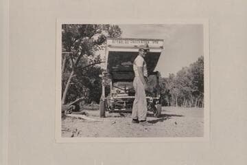 Lug Larsen preparing to unload the "Galloway" at Carr's Landing; Brown's Hole