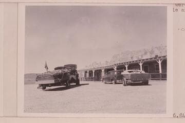 The "Step In Again" on the trailer at left and the "Twin" on the truck.  The "June Bug" on the trailer at right and Art Greene's "Cliff Dweller's Lodge"