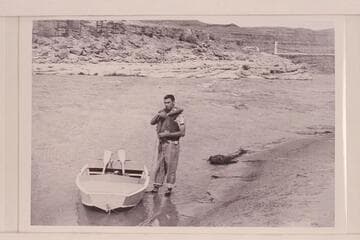 Don Wimpress and the 8-ft. pram used to navigate the San Juan from Mexican Hat to its mouth and Glen Canyon down to Lees Ferry