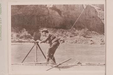 August J. Tadje with M camera on one of our boats floating downstream.  Tadje is standing on the "Titanic."