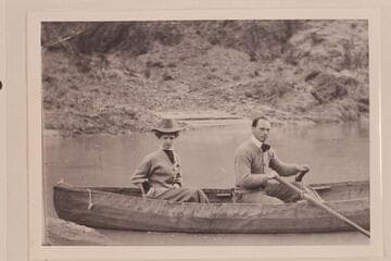 Ellsworth's first boating experience.  Posed at the oars of one of Dave Rust's folding canvas boats near Bright Angel Creek while the young lady tried to look calm and collected