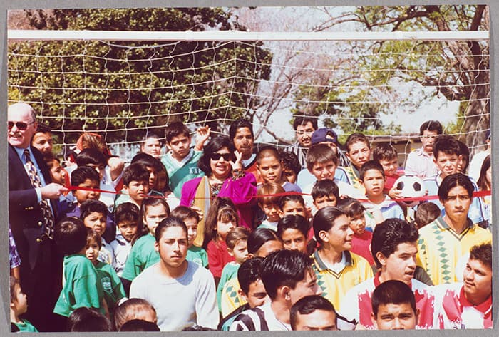 Gloria Molina standing with kids at Franklin D. Roosevelt Park