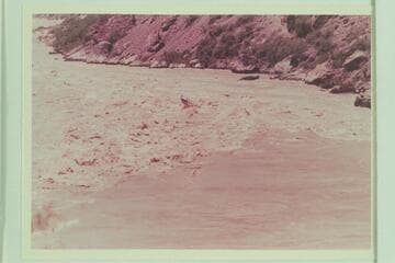 With no crew aboard, the "Bootoo" hits the heaviest waves in Vulcan Rapid. A second after this photo was made, the craft capsized