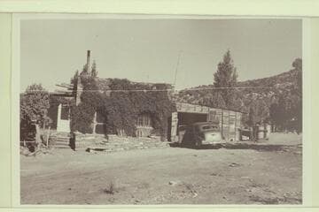 "The Lodge from south end. Screened porch at left. Living room center. Garage right where the fire started in 1951"