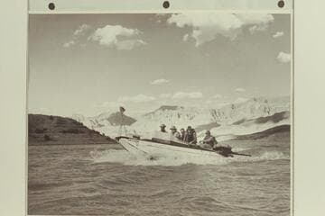 "Esmeralda II" at Pierces Ferry. The boat had just completed the first motor-powered traverse of the Grand Canyon.Left to right: Marston; Hudson; Taylor; Edward Hudson; and Robinson.The rig forward is a motion picture camera