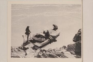 The "Esmeralda II" at camp at Mile 20. Marston; Robinson; Hudson. Her flimsy shield had already given way in the rapid at Boulder Narrows